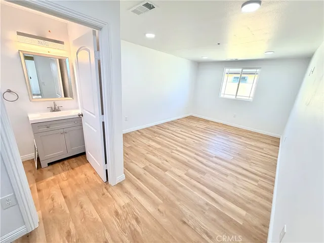 a view of a room that has a bed in it