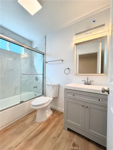 a bathroom with a toilet sink and a shower