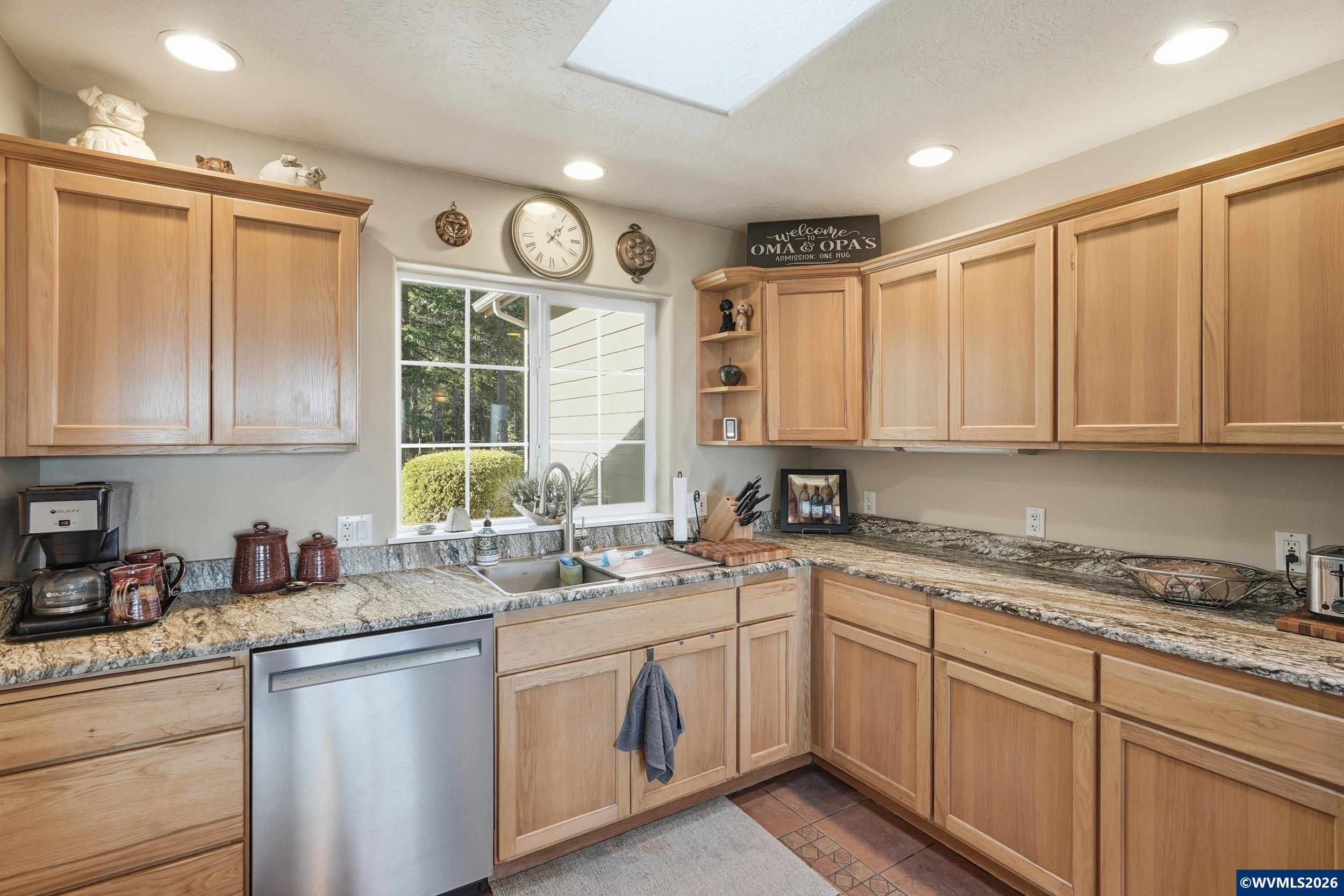 1110 Reuben Boise Road Dallas, OR 97338 - Photo 16 of 49 a kitchen with a sink window and cabinets