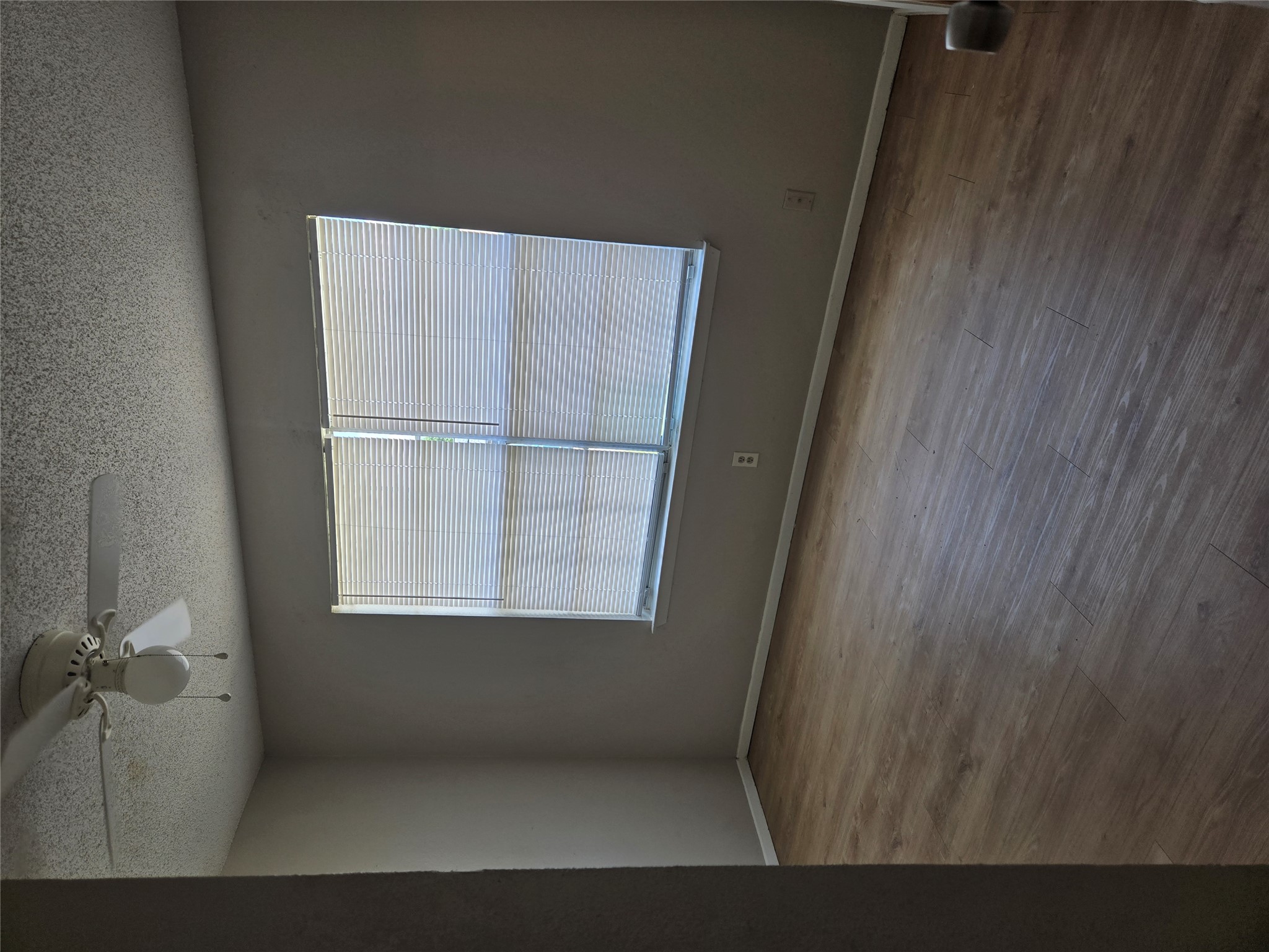1011 Ridgemont Street Round Rock, TX 78664 - Photo 6 of 11 an empty room with wooden floor chandelier and windows