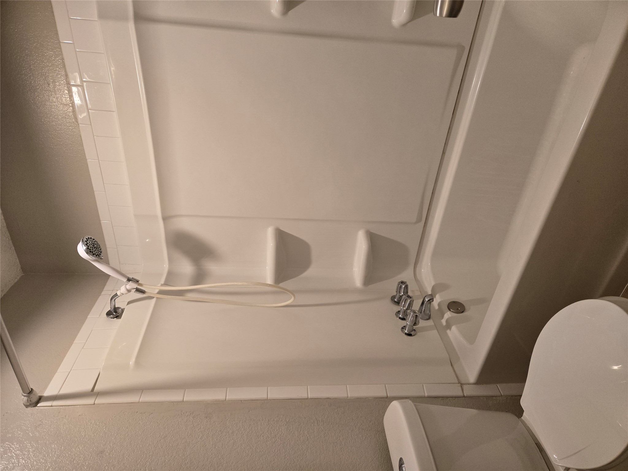 1011 Ridgemont Street Round Rock, TX 78664 - Photo 7 of 11 a bathroom with a shower a toilet and a sink