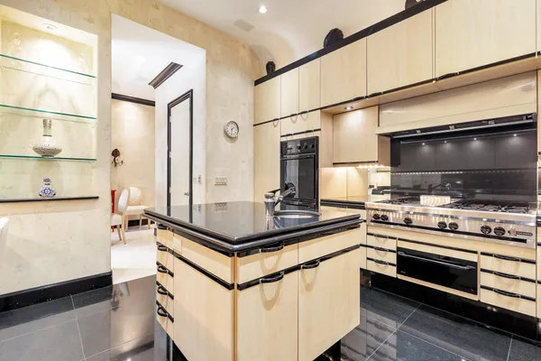 a kitchen with stainless steel appliances a stove and a refrigerator