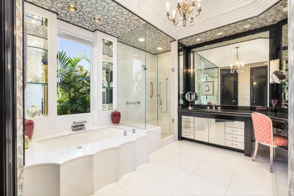 a bathroom with a double vanity sink and a bathtub