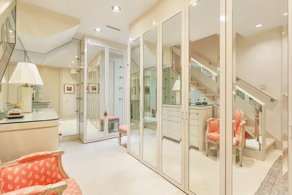a spacious bathroom with a double vanity sink a mirror and a shower