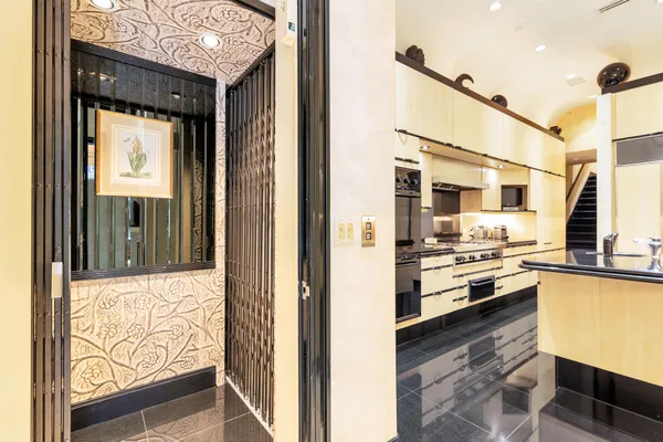 a kitchen with stainless steel appliances granite countertop a refrigerator and a stove top oven