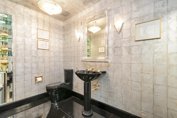 a bathroom with a sink a mirror and a shower