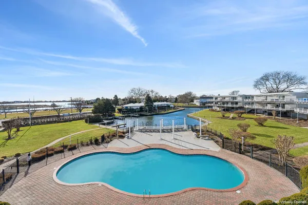 swimming pool with outdoor seating and yard