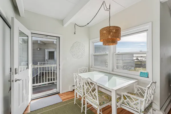 a dining room with furniture and window