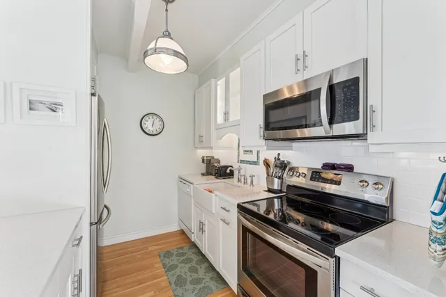 a kitchen with a stove and a microwave
