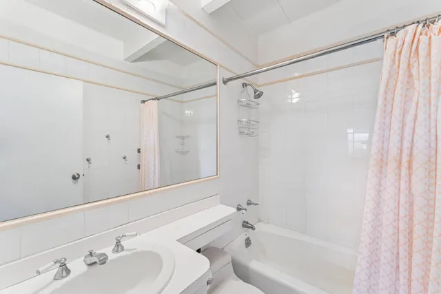 a bathroom with a bathtub and a sink