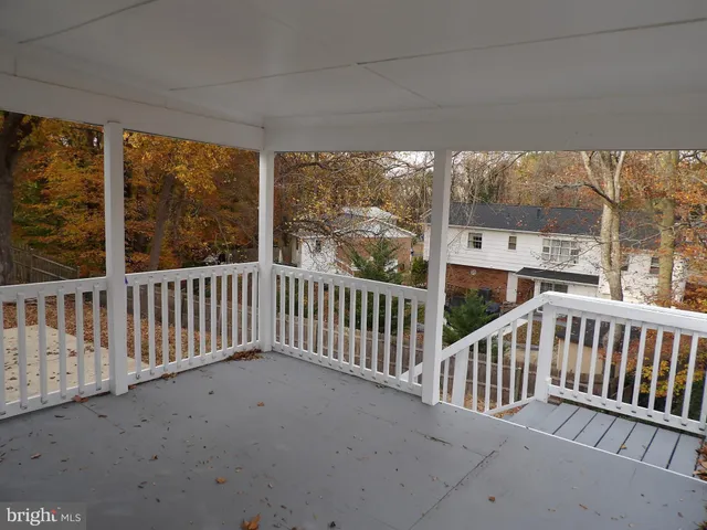 a view of a porch with a floor to ceiling window