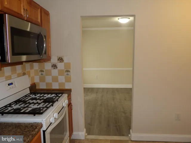 a kitchen with a stove and a microwave