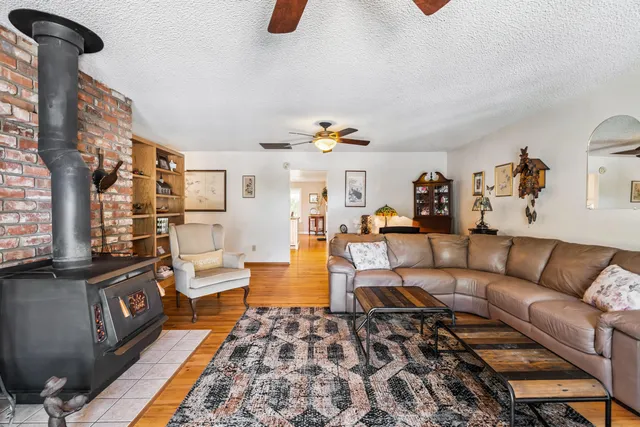 a living room with furniture and a rug
