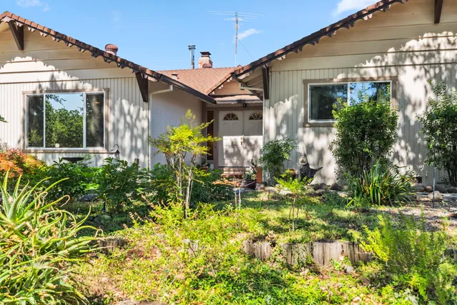 a front view of a house with a patio