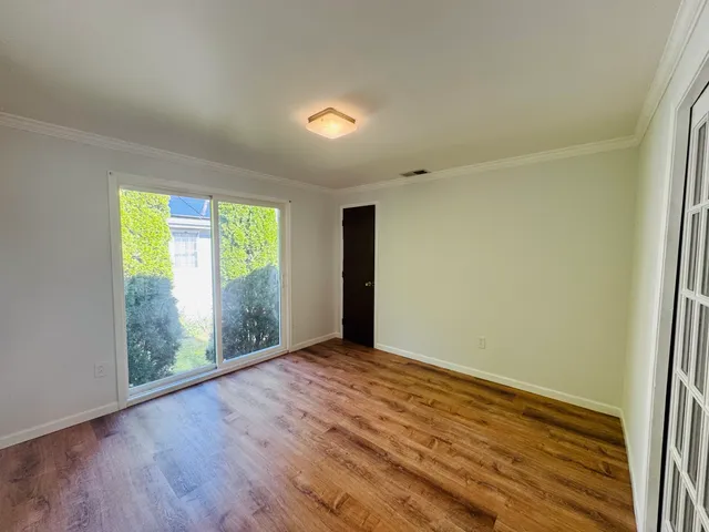 a bathroom with a sink toilet a mirror and shower