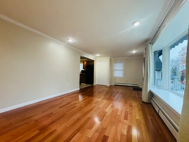 a kitchen with granite countertop next to a window