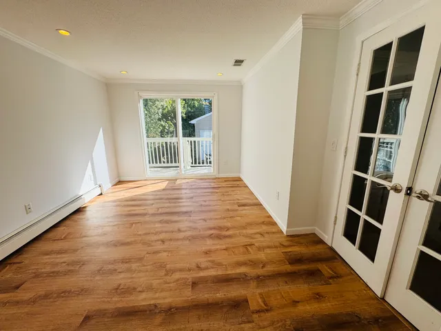 a view of an empty room and window