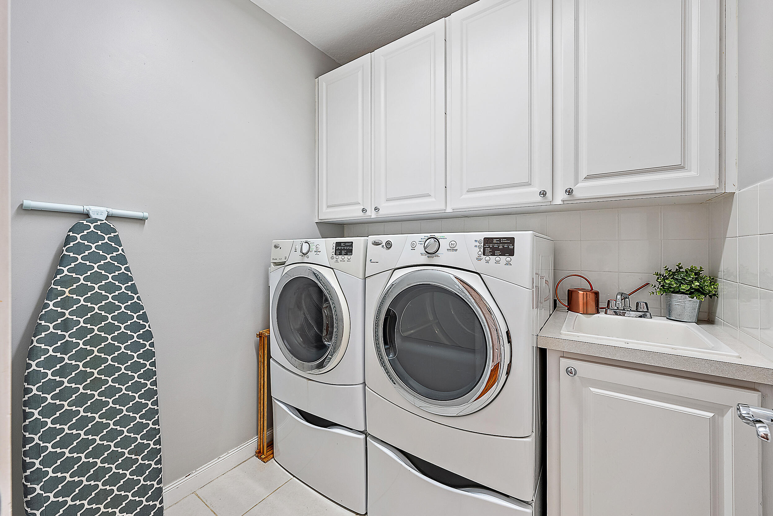 107 Rivinia Drive Jupiter, FL 33458 - Photo 14 of 28 a utility room with dryer and washer