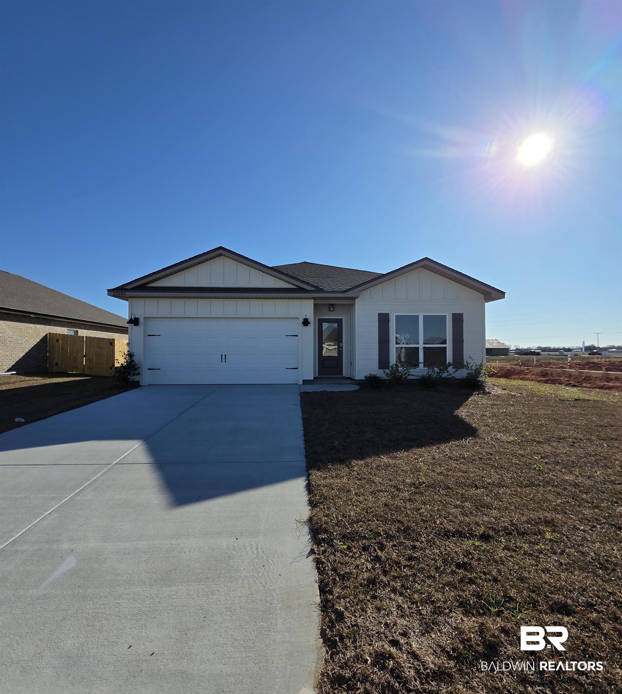 28084 Hallow Trail Elberta, AL 36530 - Photo 2 of 21 Ranch-style home with board and batten siding, concrete driveway, and a garage