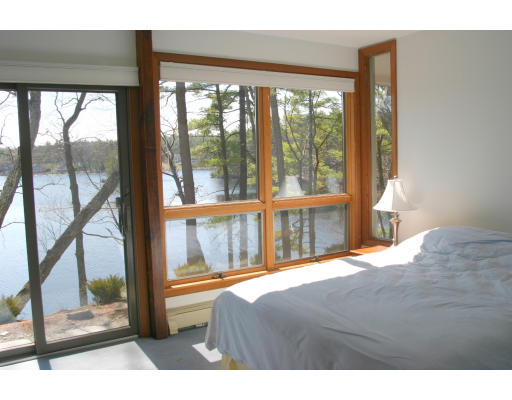 42 Willow Road Harvard, MA 01451 - Photo 23 of 26 a bedroom with a bed and a large window