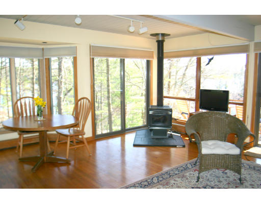 42 Willow Road Harvard, MA 01451 - Photo 8 of 26 a living room with furniture and floor to ceiling windows