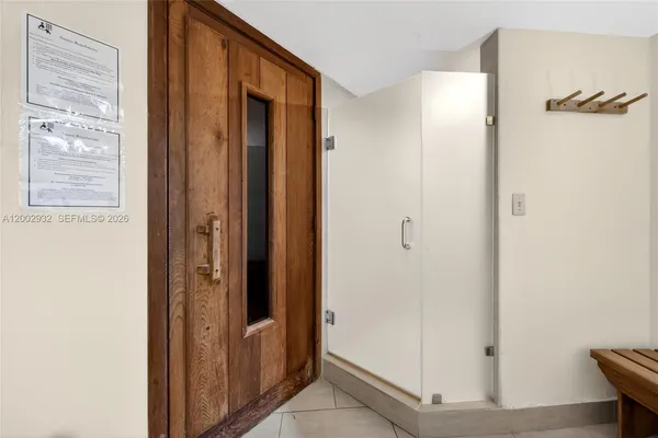 a view of a bathroom with a glass door