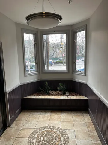 a sitting area with couch and window