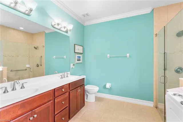 a view of a bathroom from a corridor