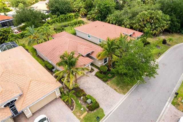 a dining room with furniture and a floor to ceiling window