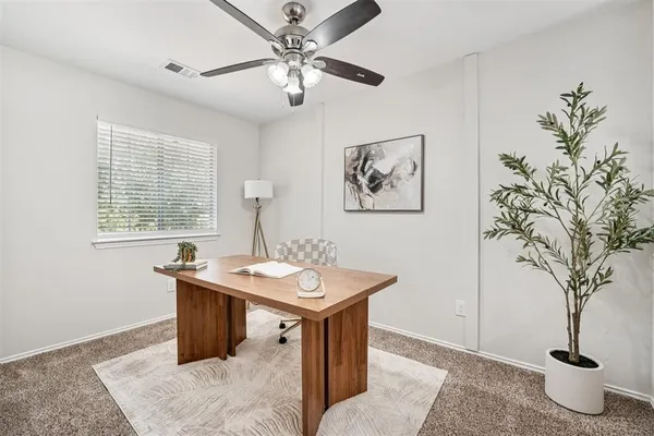 a dining room with a table and chairs