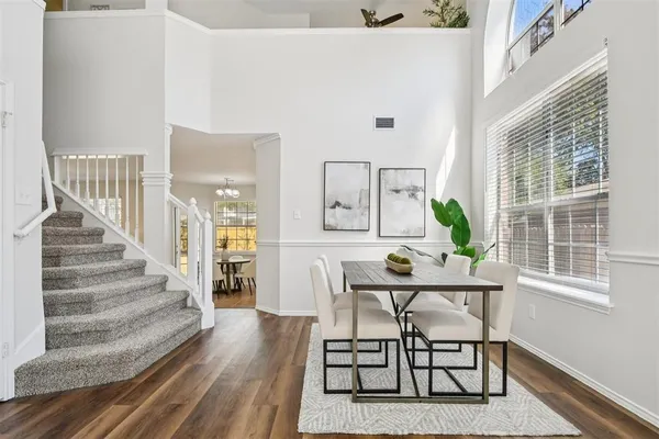 a view of a livingroom with furniture and wooden floor