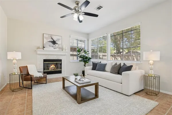 a living room with furniture and a fireplace