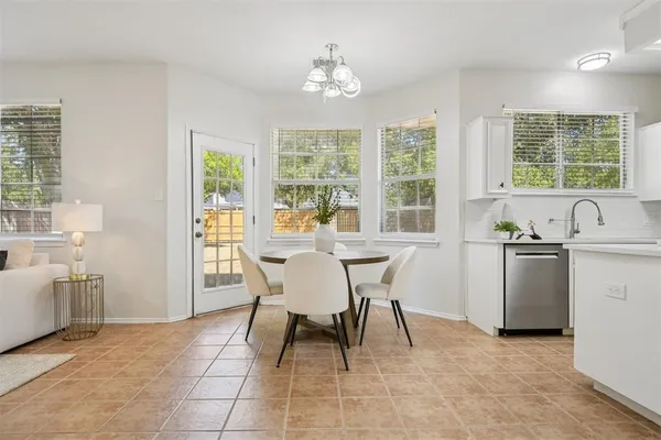 a dining room with furniture and window