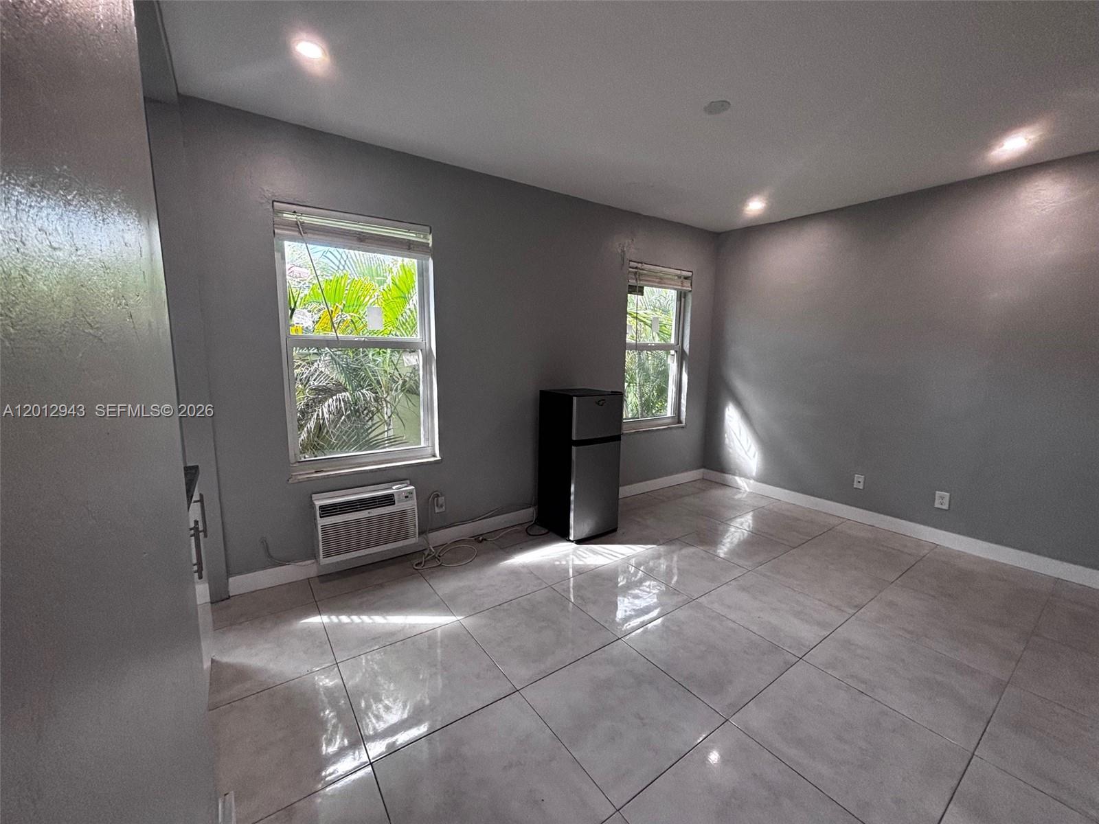 319 West 28th Street, Unit 15 Miami Beach, FL 33140 - Photo 2 of 6 a view of an empty room with a window