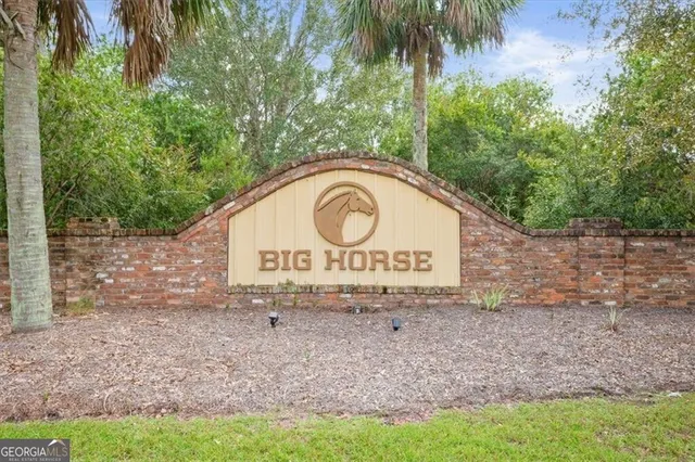 a view of outdoor space with garden and trees