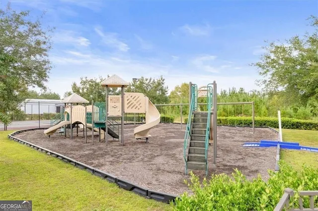 a view of a park with swings and slides