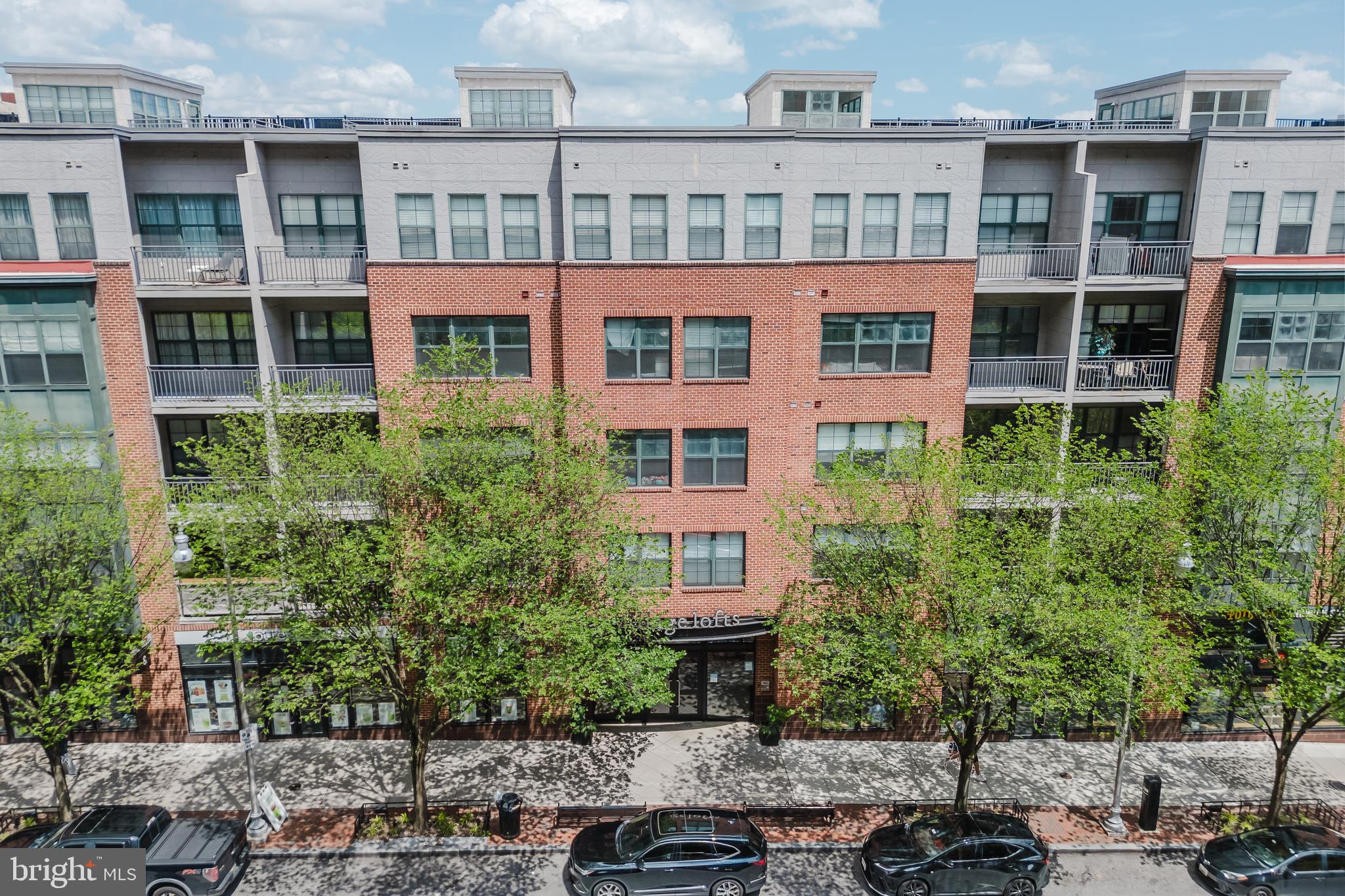3201 St Paul Street, Unit 412 Baltimore, MD 21218 - Photo 20 of 23 a view of a brick building next to a yard