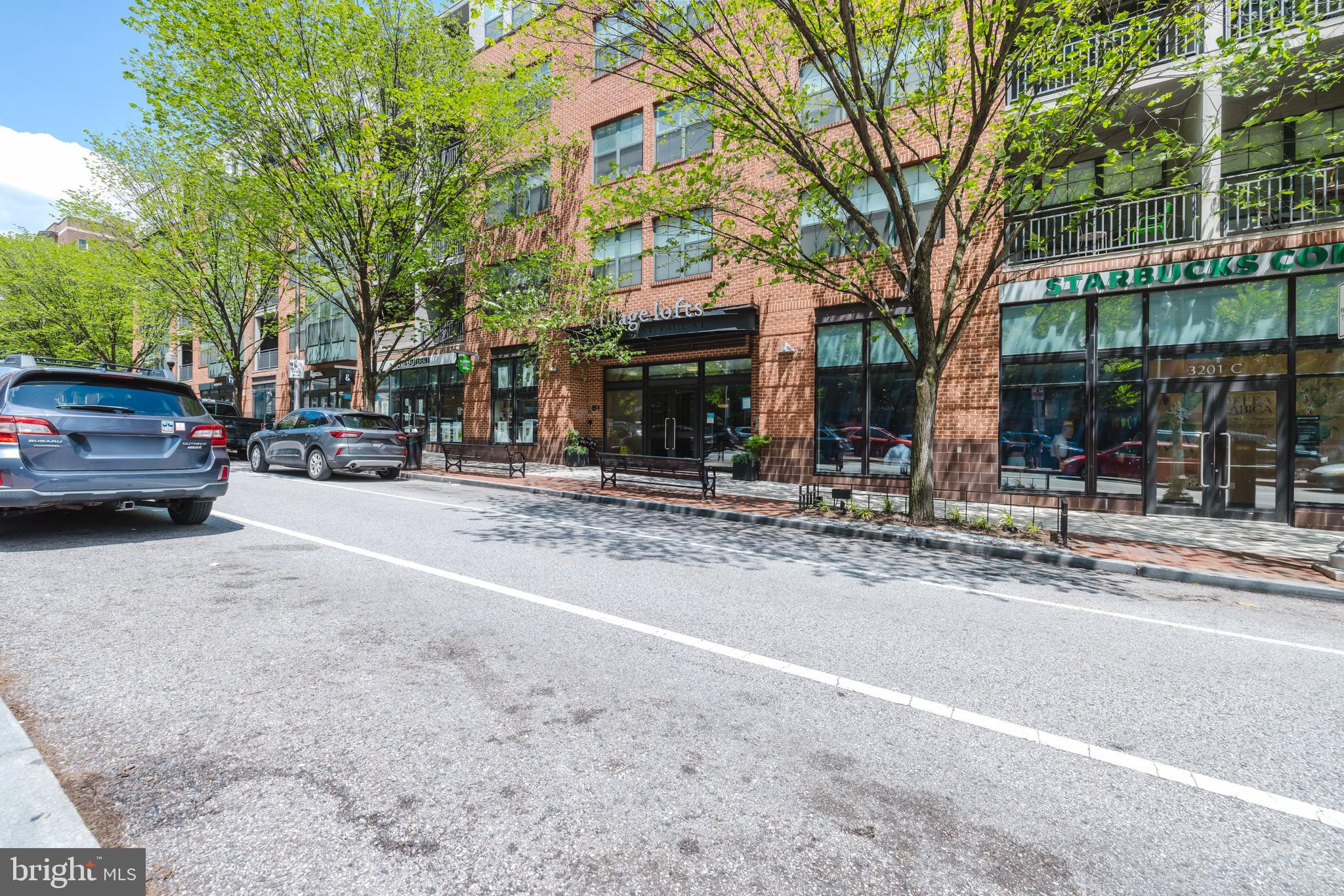 3201 St Paul Street, Unit 412 Baltimore, MD 21218 - Photo 22 of 23 a view of street with parked cars
