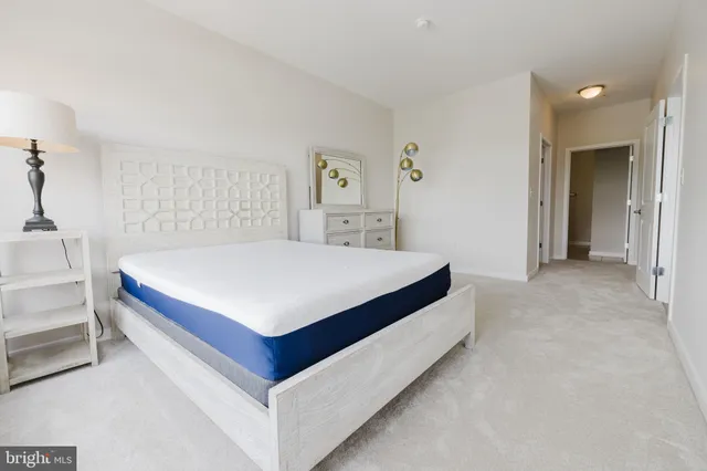 a bedroom with a bed and a table