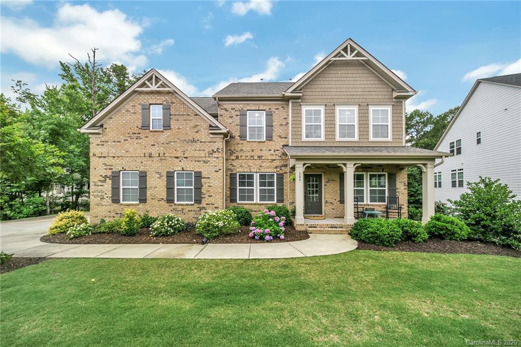 309 Calming Way Tega Cay, SC 29708 - Photo 1 of 41 a front view of a house with a yard