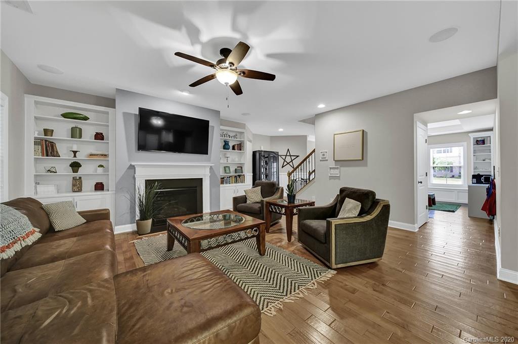 309 Calming Way Tega Cay, SC 29708 - Photo 11 of 41 a living room with furniture a flat screen tv and a fireplace