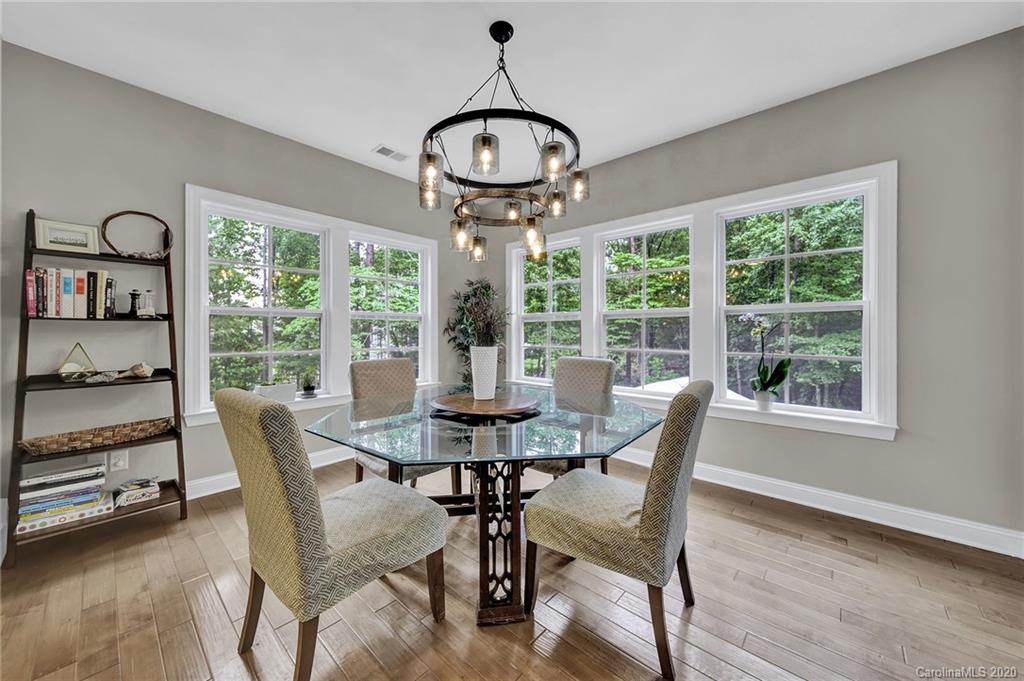 309 Calming Way Tega Cay, SC 29708 - Photo 18 of 41 a view of a dining room with furniture window and outside view