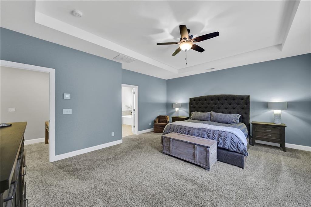309 Calming Way Tega Cay, SC 29708 - Photo 21 of 41 a bedroom with a bed and window