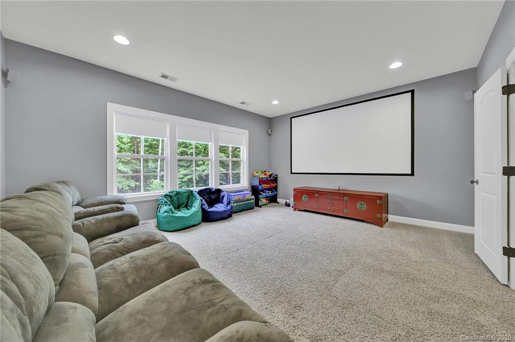 309 Calming Way Tega Cay, SC 29708 - Photo 24 of 41 a living room with furniture and a flat screen tv