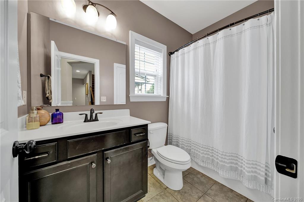 309 Calming Way Tega Cay, SC 29708 - Photo 33 of 41 a bathroom with a sink a toilet and shower