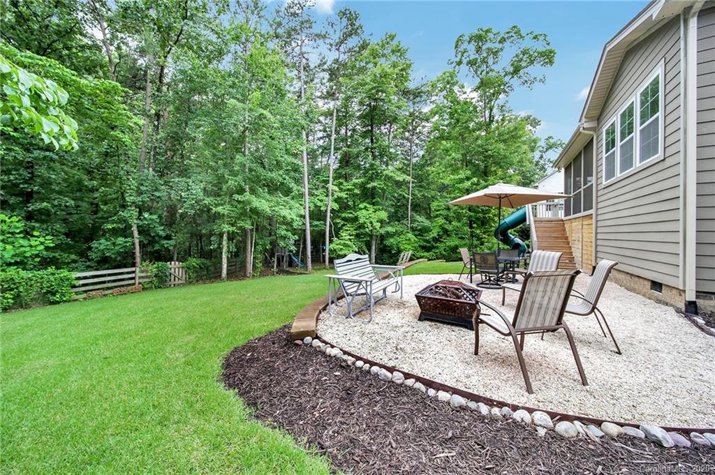309 Calming Way Tega Cay, SC 29708 - Photo 36 of 41 a view of a backyard with sitting area