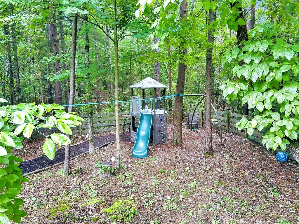309 Calming Way Tega Cay, SC 29708 - Photo 38 of 41 a view of a garden with a patio
