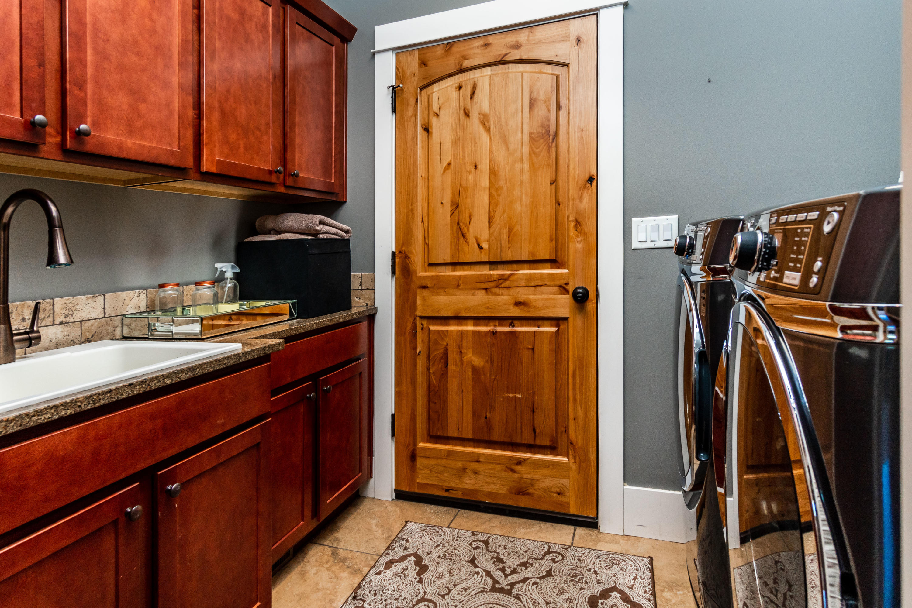 19525 Apache Road Bend, OR 97702 - Photo 27 of 47 a kitchen with stainless steel appliances granite countertop a refrigerator and a sink