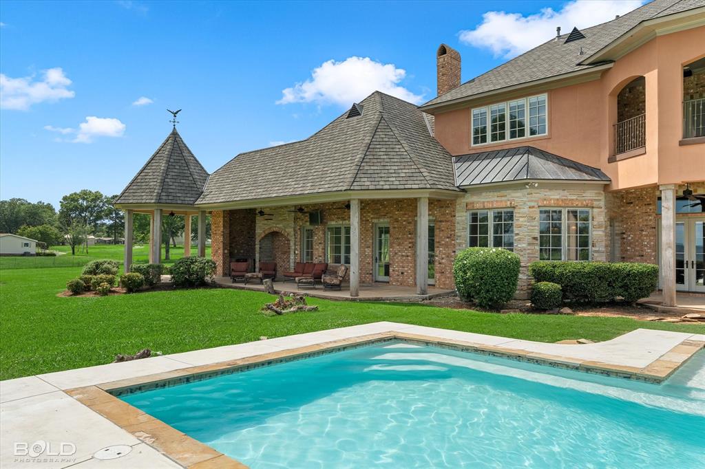 10099 Ferry Lake Road Oil City, LA 71061 - Photo 10 of 14 Resort-style pool with peaceful waterfront views