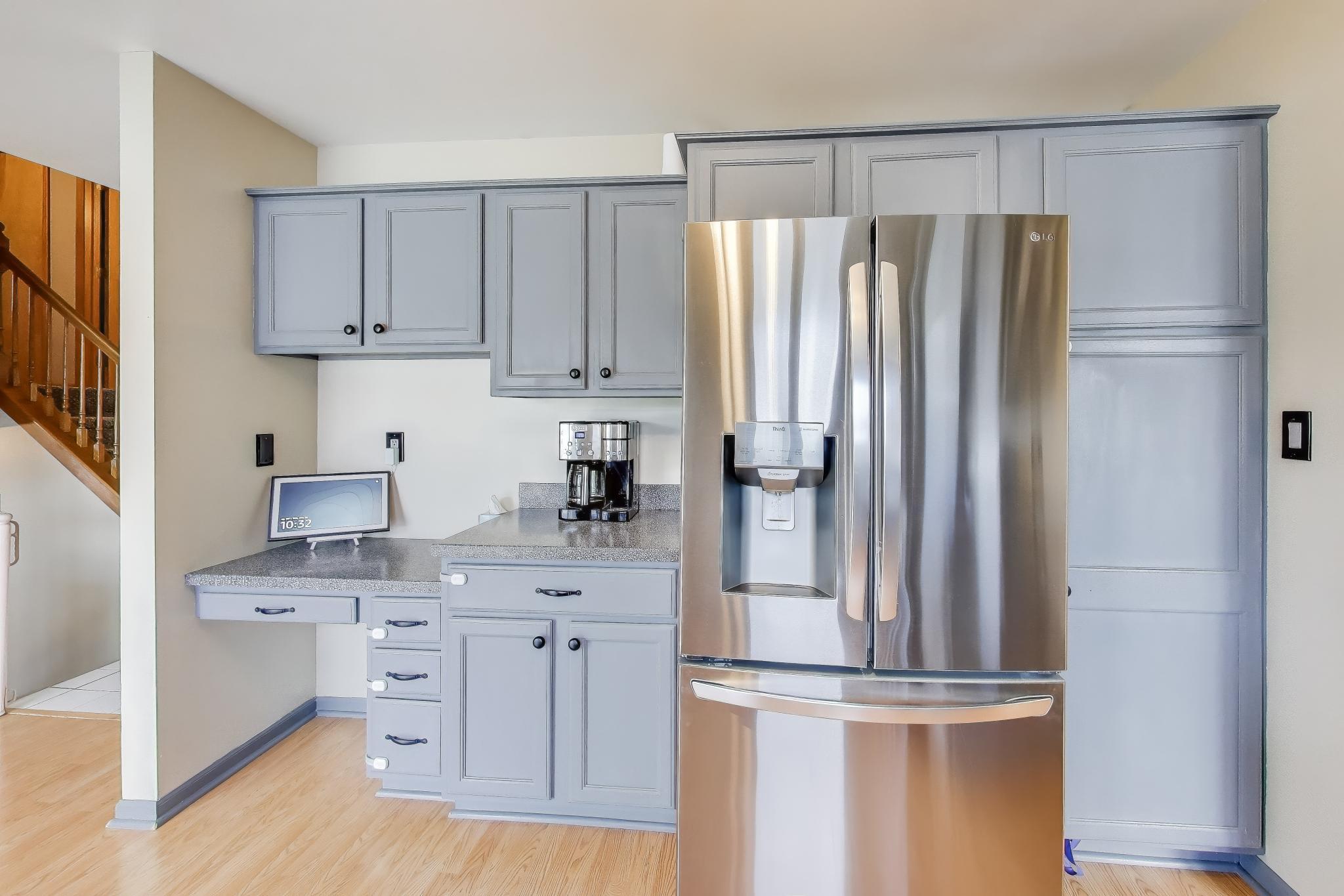 6926 Hawk Drive Schererville, IN 46375 - Photo 14 of 44 a kitchen with stainless steel appliances a refrigerator and cabinets